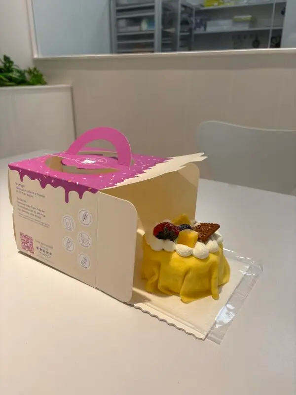bento cake box open front with cake ready to slide in