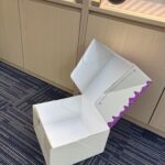 custom printed cake box with logo held in hand