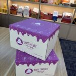custom cake boxes white corrugated with purple drip design stacked