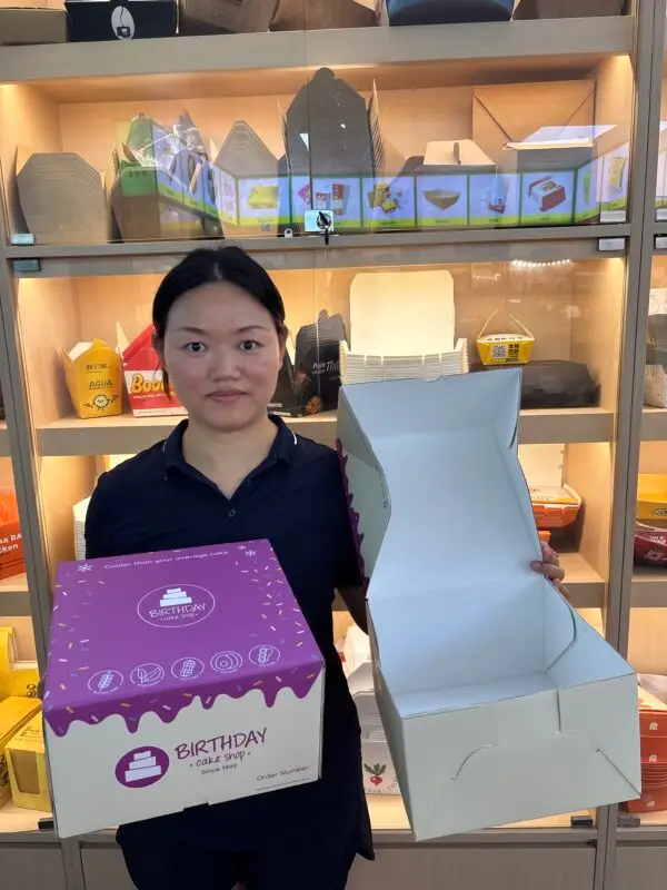 custom cake boxes shown by Manson packaging team in showroom